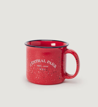 a red mug with white text  reading  Central Park Est 1858, NYC on a grey background