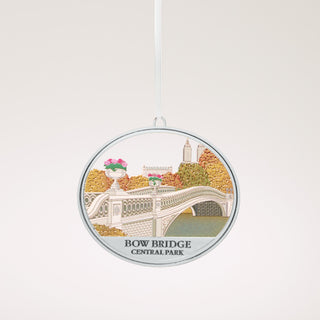 Bow Bridge Central Park ornament with a detailed design of the bridge and surrounding foliage.