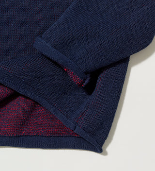 Close-up of the sleeve and inner lining of navy "Central Park NYC" sweater 
