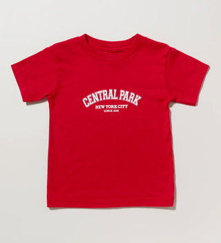 a red child sized t-shirt with Central Park New York City since 1858 in white ink on a grey background