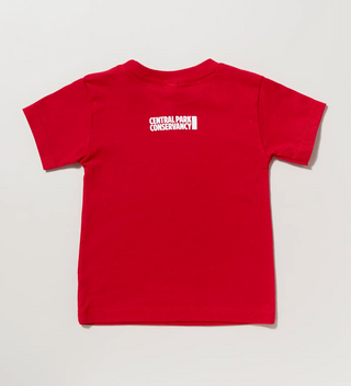 a child sized red t-shirt with a Conservancy logo printed in white ink on a grey background