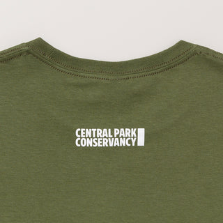 Green shirt with 'Central Park Conservancy' logo in white. The shirt is laying flat on a light gray background.