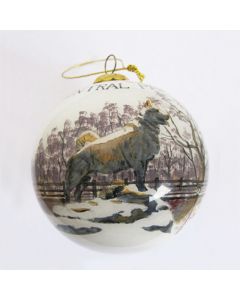 This globular glass ornament shows an image of the popular statue of Balto with "Central Park, NYC" inscribed on the side. Adapted from a photo taken by the official historian and photographer of Central Park Conservancy, this ornament is painstakingly ha