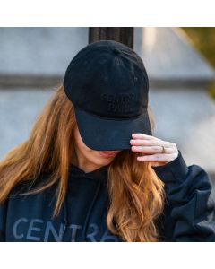 The Monochrome Baseball Cap is a 100% cotton 6-panel open back hat that has a curved brim and an adjustable strap with "NEW YORK" stitching and a gunmetal buckle. “CENTRAL PARK” is embroidered on the front. 