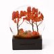 This snow globe features iridescent flakes reminiscent of falling leaves in Central Park. Each glass globe is packaged in a gift box with a protective foam insert. Measures 4