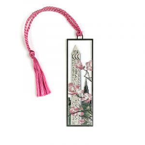 The Central Park Cleopatra's Needle bookmark is made from solid brass and electro-plated with a non-tarnishing silver finish. The string attached to it is light pink in color. Measures 1x3.5